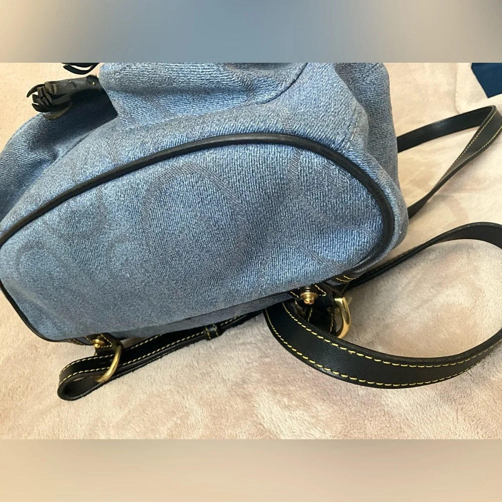 Dooney & Bourke Vintage Canyon Backpack in blue denim. 10.5”x 9.25”x 4”